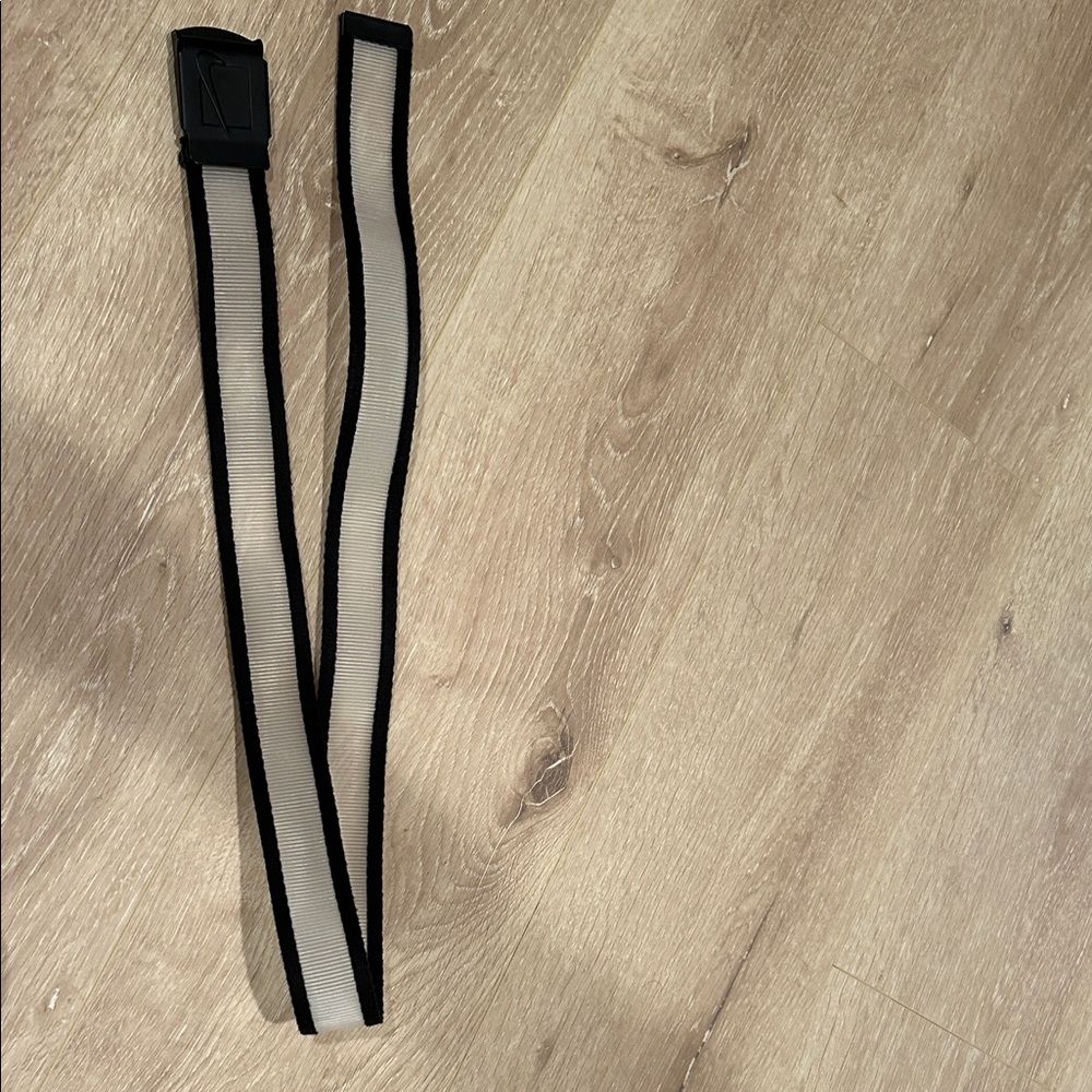 Black and Clear Nike men’s golf belt with bottle opener on buckle